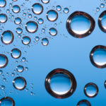 abstract blue vibrant water drops background